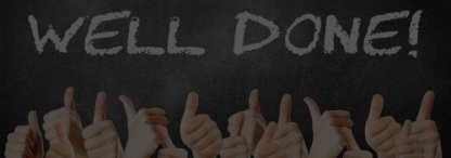 A photo of several hands giving thumbs up against a blackboard with well done written in white chalk