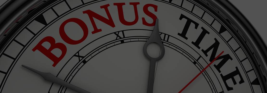 A closeup of a chrome coloured clock displaying the words BONUS TIME in black and red isolated on a white background
