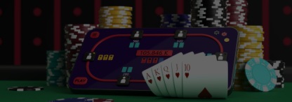 A smartphone with displaying an online poker table laid against stacks of poker chips on a real poker table