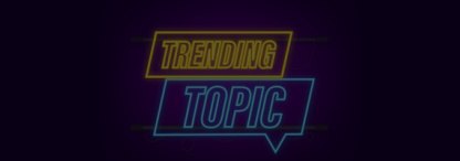A neon sign of the words ‘trending topic’ on a dark background