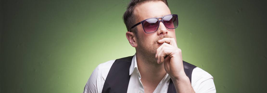 male poker player deep in thought
