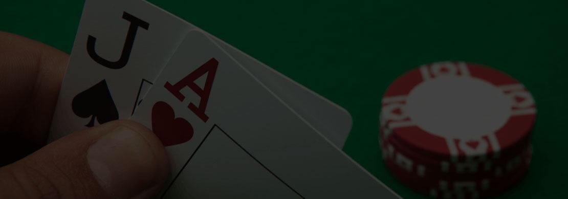 cards showing blackjack and poker chips