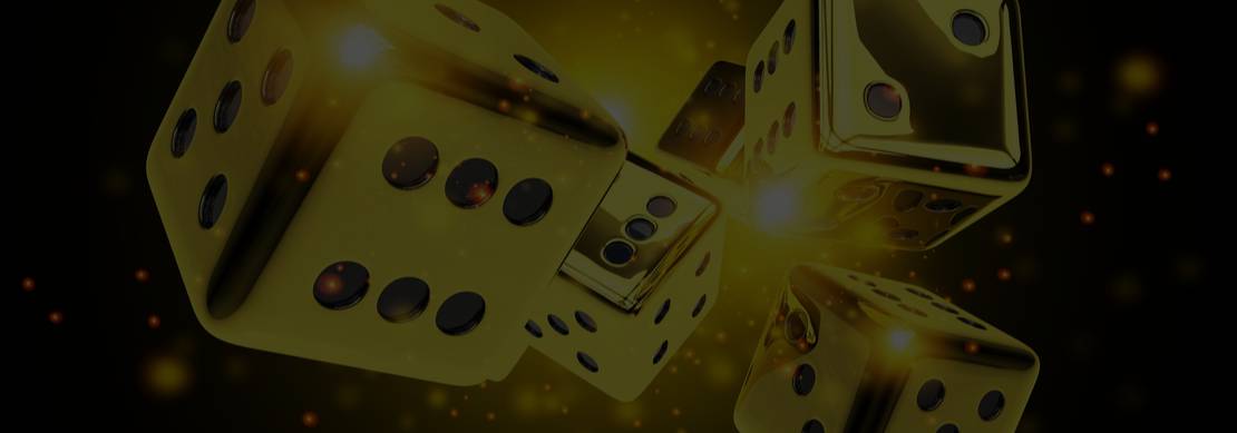 Golden dice bursting from a dazzling gold on black background