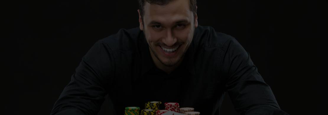 happy poker player with a pile of chips