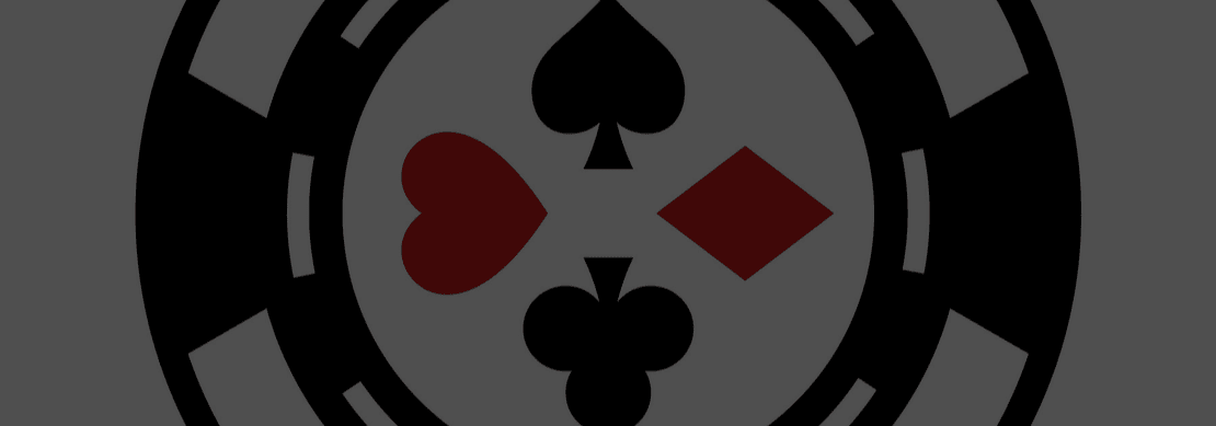 black and white poker chip with the spade, heart, diamond, club symbols