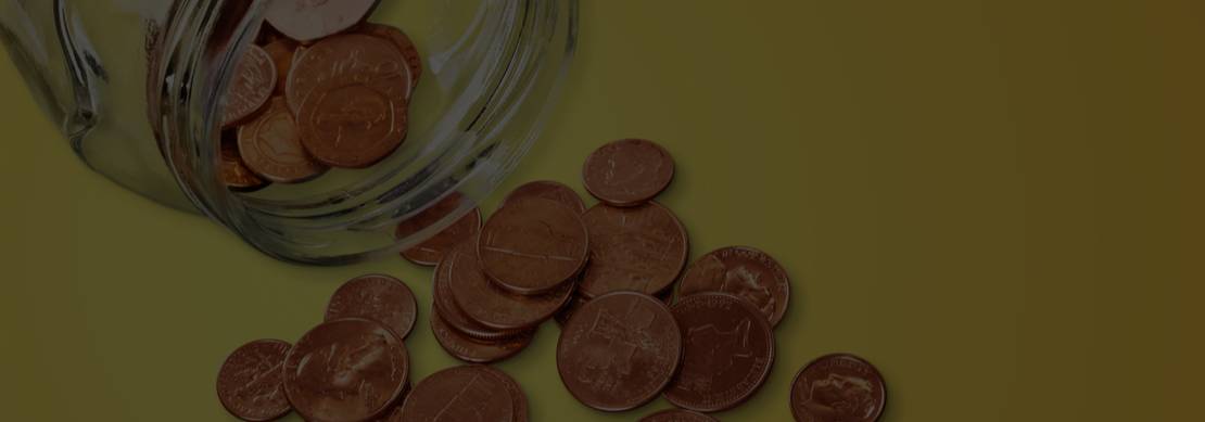 pennies and small change spilling out of a jar on a yellow background