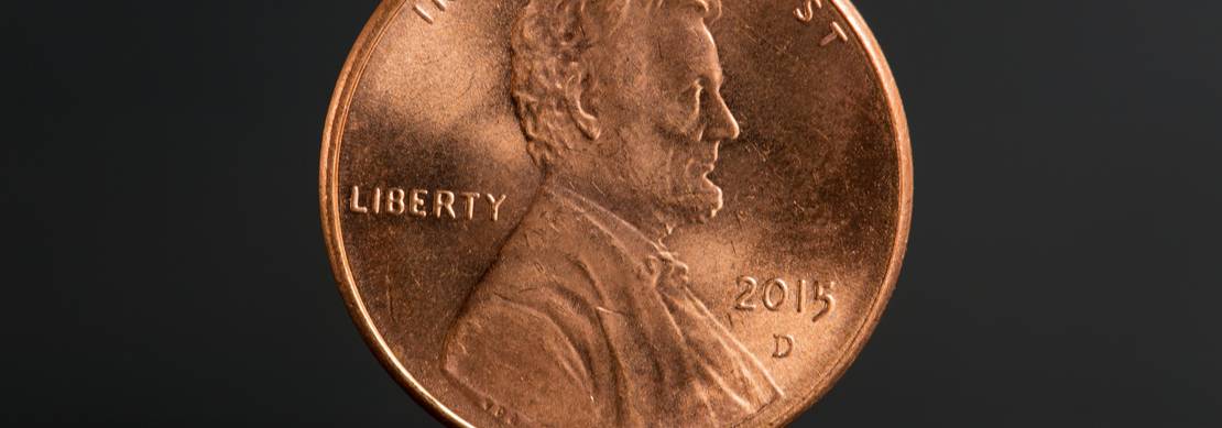 a US penny on a dark grey background