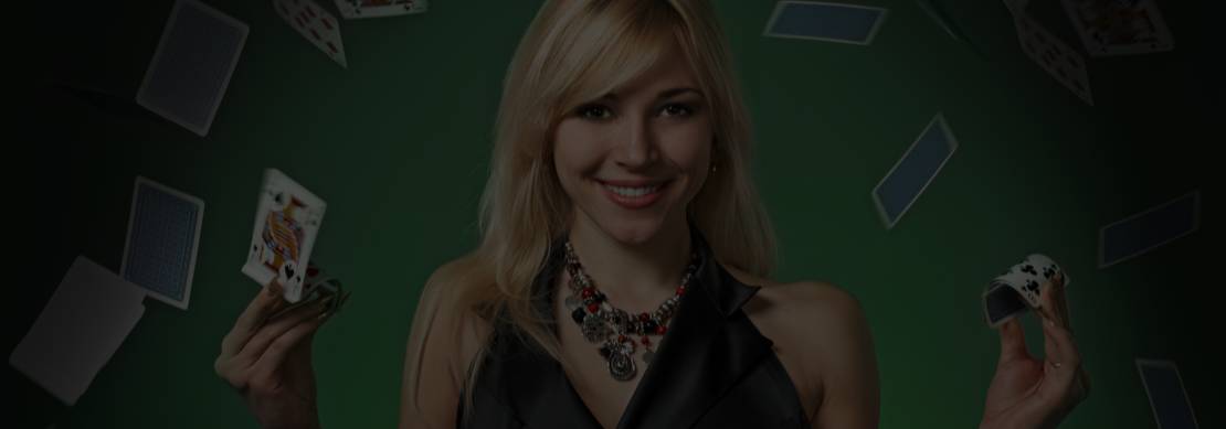 young blonde woman in a black dress on a green background is smiling as she wins in online poker